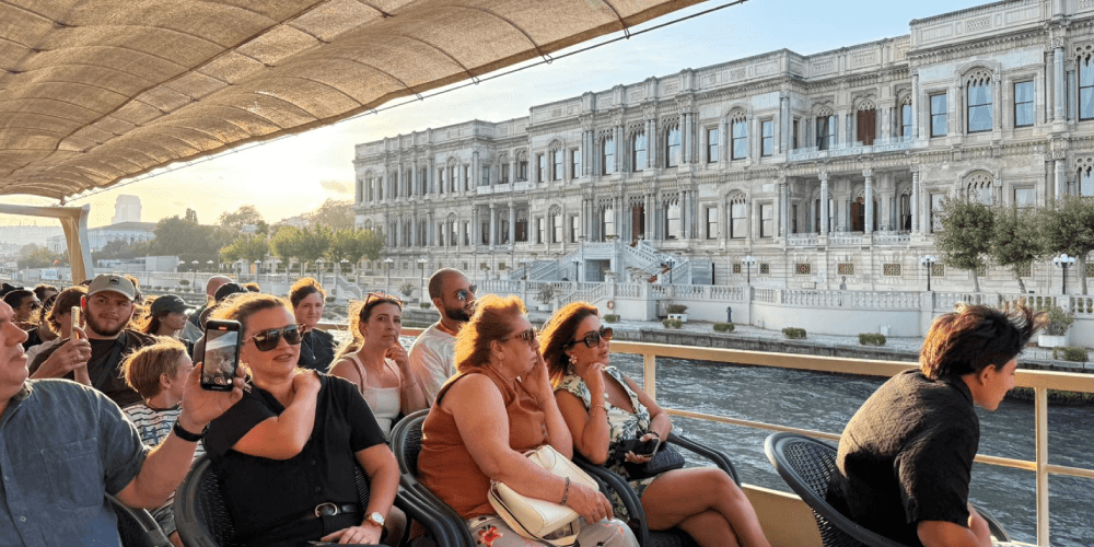 Bosphorus sunset cruise in Istanbul with golden sky reflecting on the water