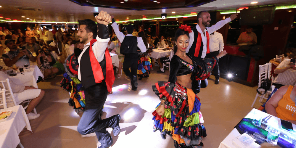 Guests watching an energetic Turkish Night Show aboard a Bosphorus cruise