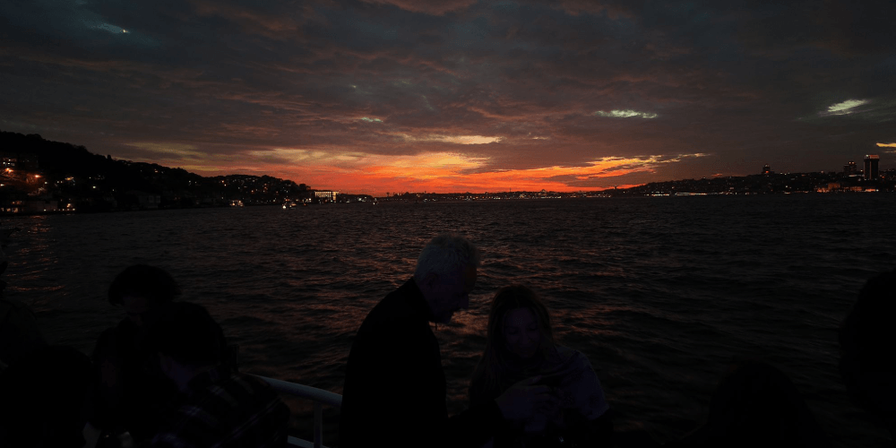 Scenic Istanbul skyline at sunset viewed from Bosphorus tour boat