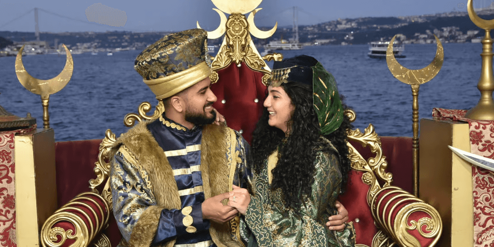 Tourists taking photos on deck during Bosphorus dinner cruise